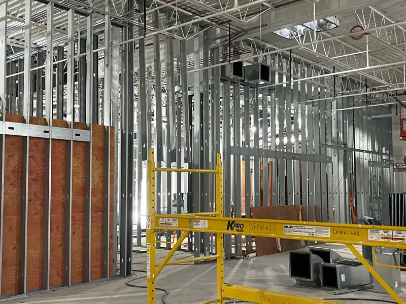 Metal stud framing with scaffolding on a retail renovation